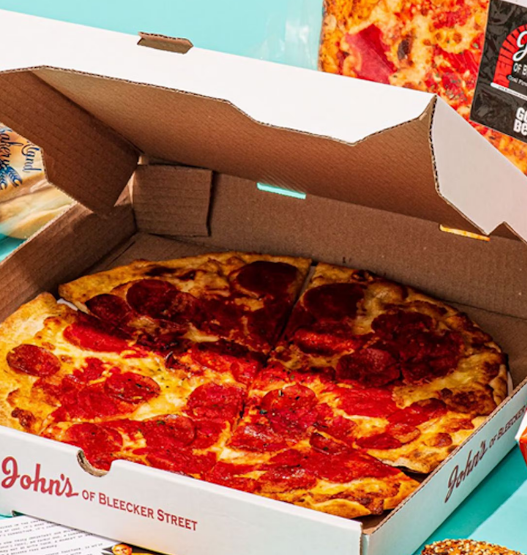 Gourmet monthly pizza subscription box featuring an assortment of artisanal pizzas in a stylish branded cardboard box.