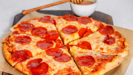 Hot Honey Pepperoni Pizza with curled cup-and-char pepperoni and a spicy honey drizzle on golden crust