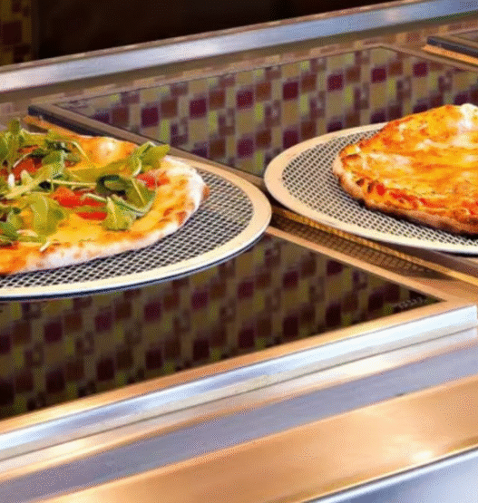 Carnival cruise pizza station with freshly baked slices on a late-night deck