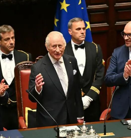 King Charles III enjoying pizza during Italy visit