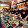 Freshly baked Blaze Pizza being pulled from a fast-fire’d oven with custom toppings
