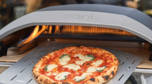 Freshly baked Neapolitan pizza on Ooni oven in backyard setting